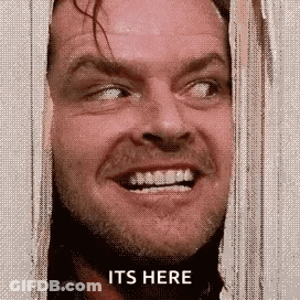 Man Behind Curtain Saying It's Here GIF