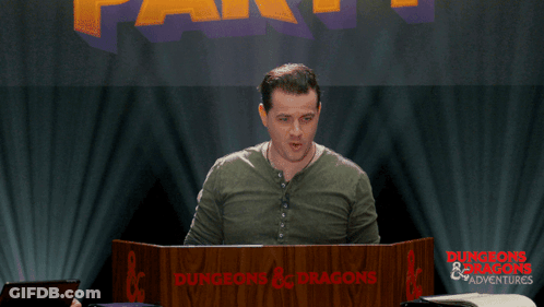 Man Behind Dungeons & Dragons Podium GIF