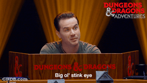 Man Behind Dungeons & Dragons Podium GIF
