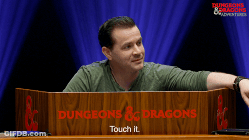 Man Behind Dungeons & Dragons Podium GIF