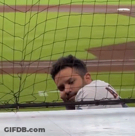 Man Behind Fence Wearing Jersey 'A GIF