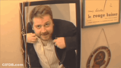 Man Behind Le Rouge Baiser Sign GIF