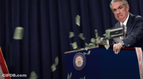 Man Behind Podium With Money Falling GIF