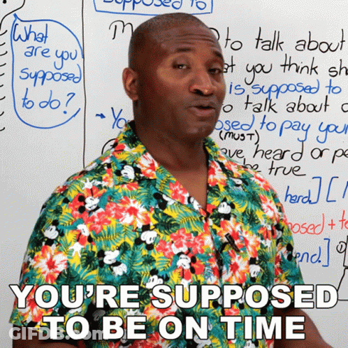 Man Beside White Board Saying You're Supposed To Be On Time GIF
