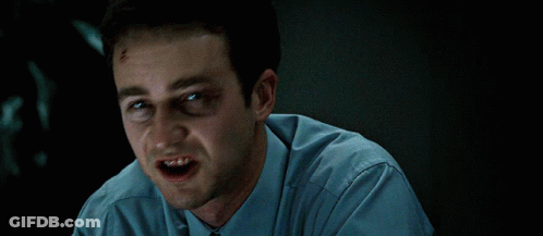 Man Black Eye Blue Shirt Making Face GIF