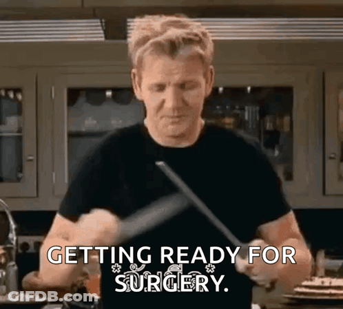 Man Black Shirt Holding Knife Spatula Getting Ready For Surgery GIF