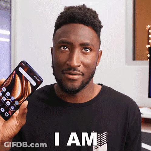 Man Black Shirt Holding Phone Saying I Am GIF