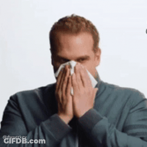 Man Blowing Nose With Napkin GIF