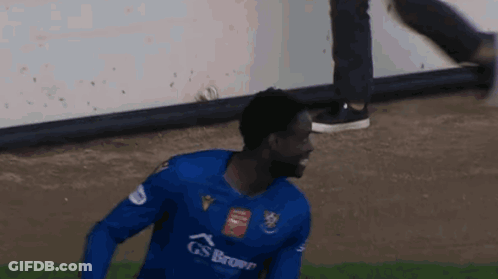Man Blue Gs Brown Jersey Running On Soccer Field GIF