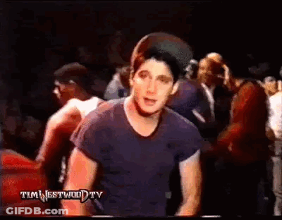 Man Blue Shirt Before Crowd In Dark Room GIF