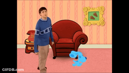 Man Blue Sweater Beside Red Chair Blue Dog GIF