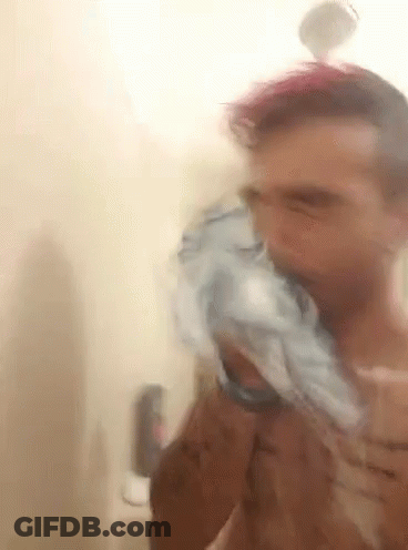 Man Brushing Teeth In Shower GIF