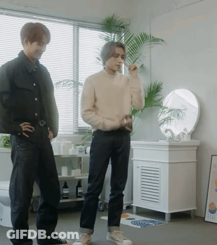 Man Brushing Teeth Next To Another Man GIF