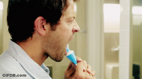 Man Brushing Teeth With Blue Toothpaste GIF