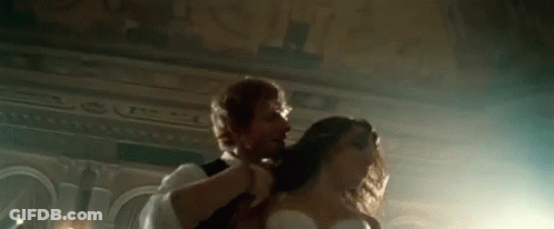 Man Brushing Woman's Hair While Dancing GIF