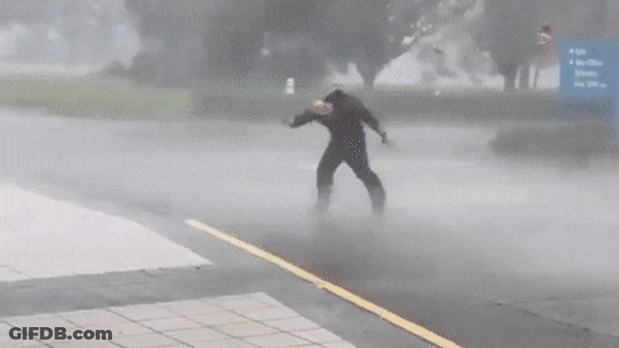 Man Carried By Hurricane Wind GIF