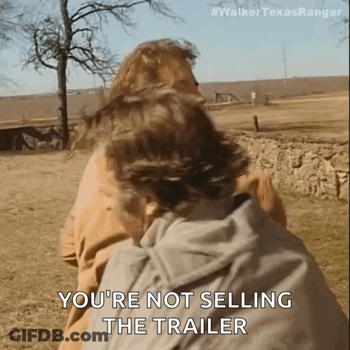 Man Carrying Another Man On His Back In Field GIF