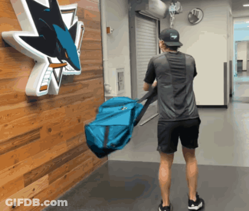 Man Carrying Blue Bag At San Jose Sharks GIF