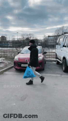 Man Carrying Blue Bag Walking GIF