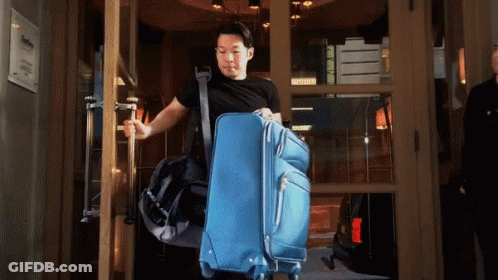 Man Carrying Blue Suitcase And Black Bag GIF