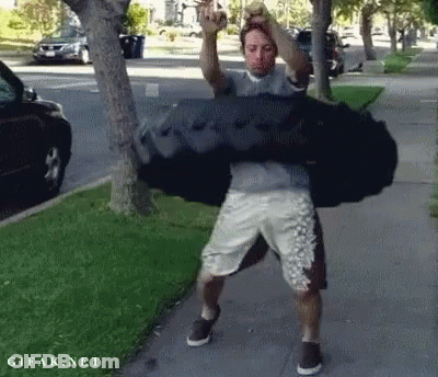 Man Carrying Large Black Bag GIF
