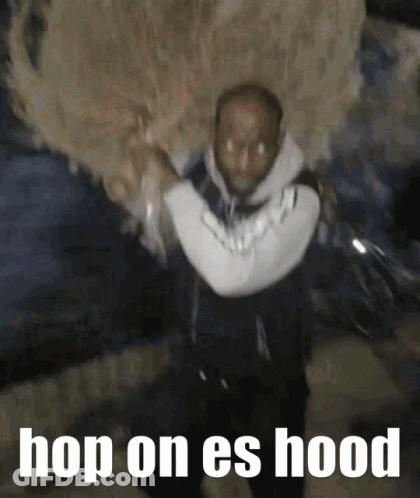Man Carrying Large Object Hop On Es Hood GIF