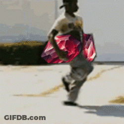 Man Carrying Large Red And Purple Item GIF