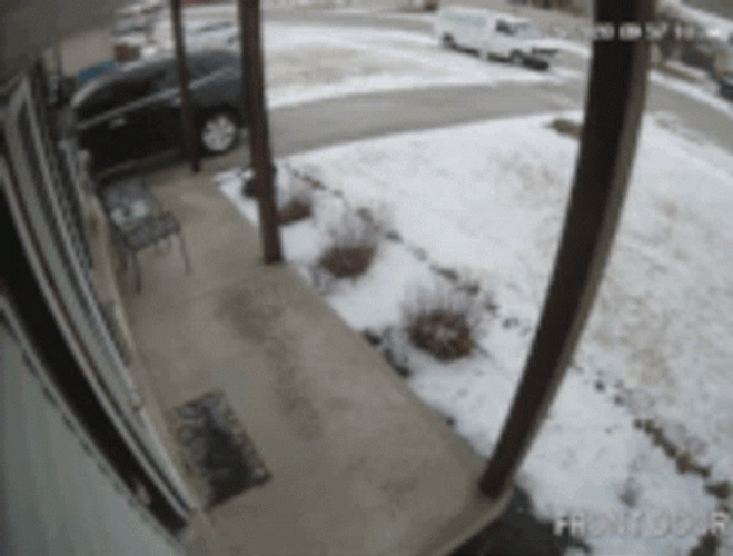 Man Carrying Lot Of Things Slipping On Ice GIF