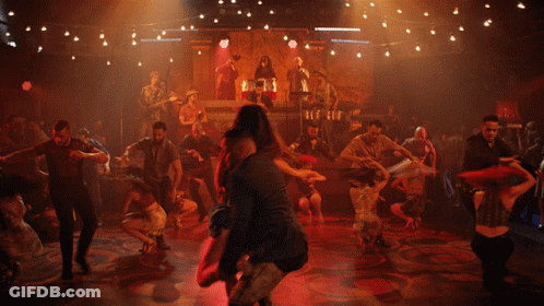 Man Carrying Woman In Arms On Dance Floor GIF