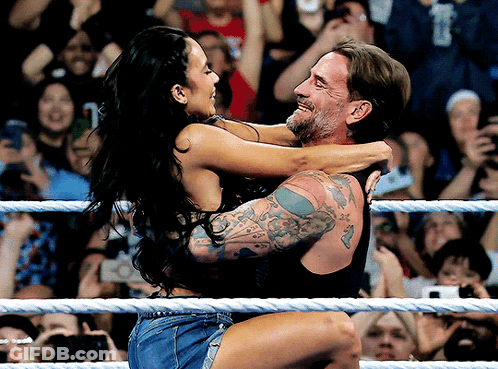 Man Carrying Woman In Wrestling Ring GIF