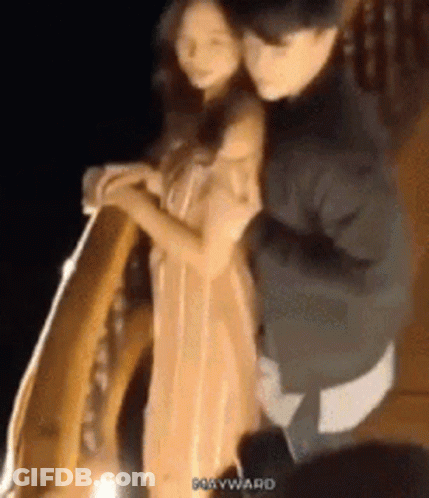 Man Carrying Woman On Back In Dark Room GIF
