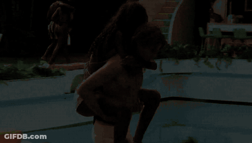 Man Carrying Woman On Back In Swimming Pool GIF