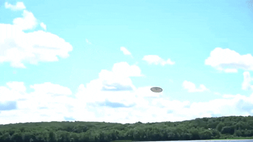 Man Catches Frisbee In The Sea GIF
