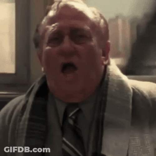 Man Catching Sneeze Spray GIF