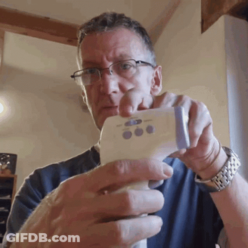 Man Checking His Temperature Using Digital Thermometer GIF