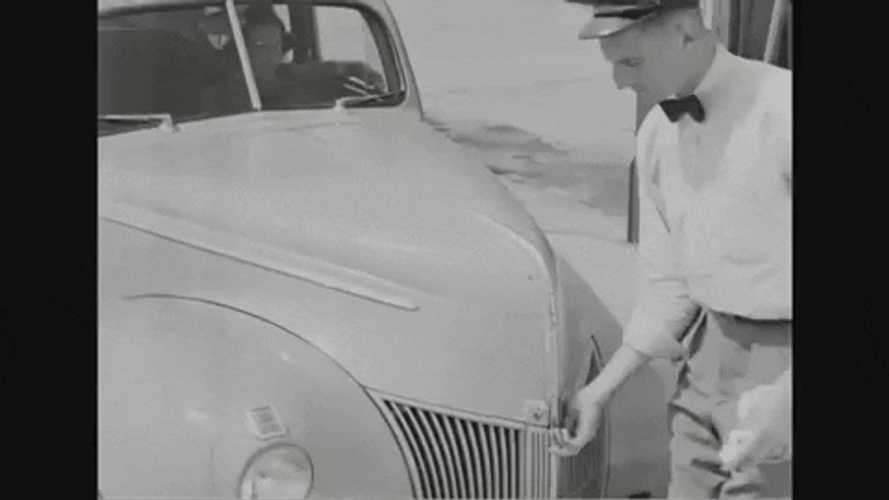 Man Checking Oil During 40S GIF