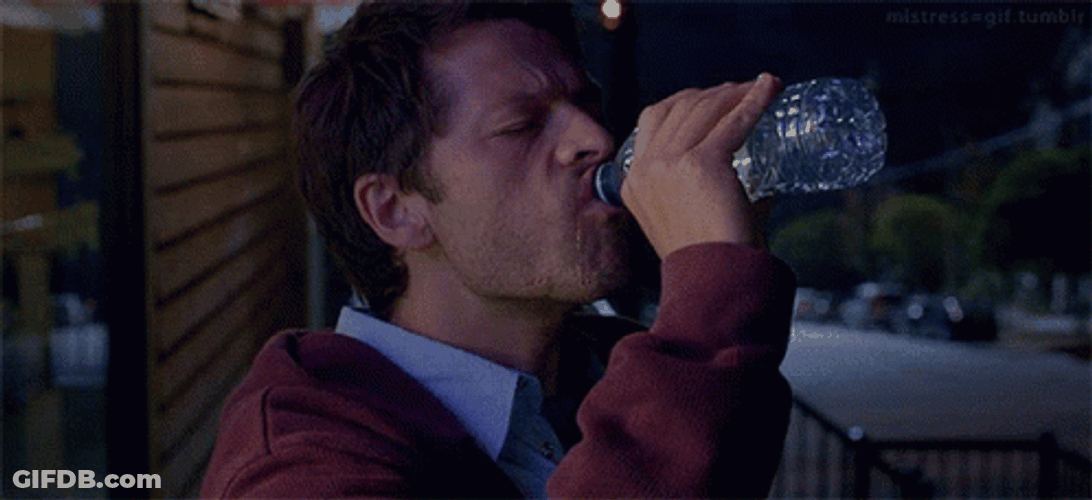 Man Chugs Drinking Water On Bottle GIF