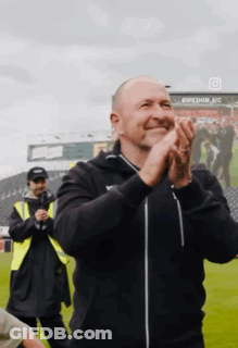 Man Clapping Hands In Field GIF