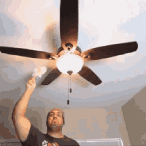 Man Cleaning Ceiling Fan GIF