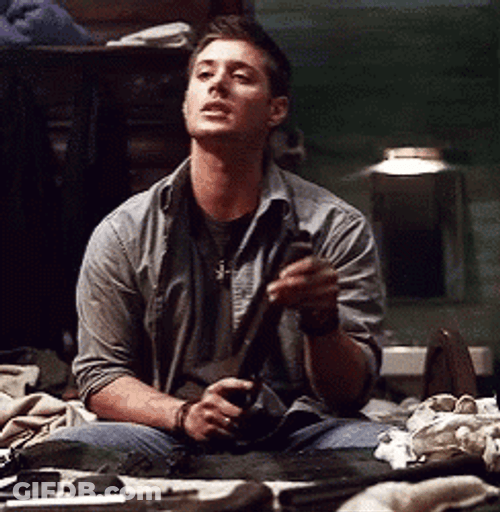 Man Cleaning Shotgun GIF