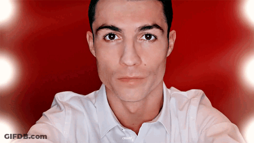 Man Close Up Red Background White Shirt Saying CR7 GIF
