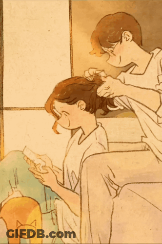 Man Combing Woman's Hair With Cat GIF