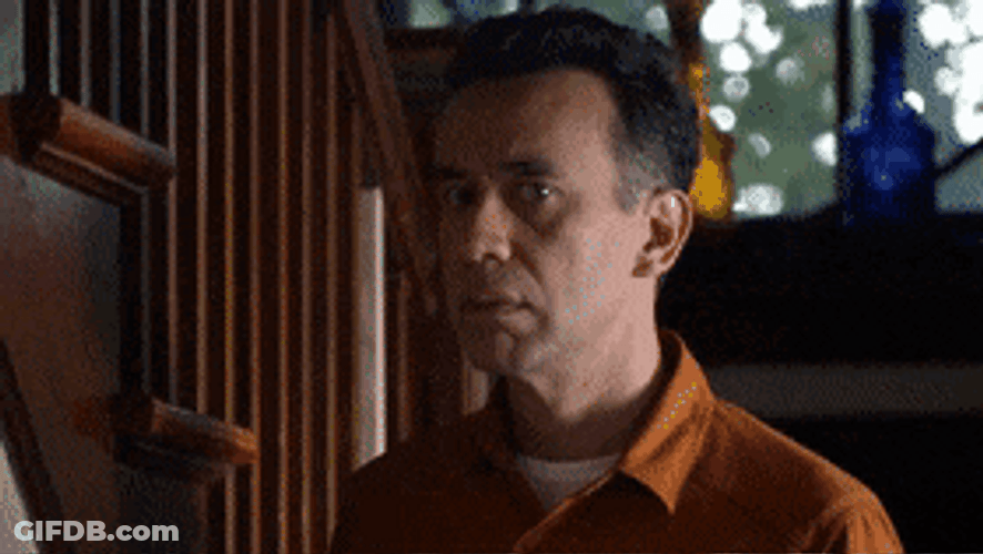 Man Consciously Peeking GIF