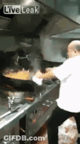 Man Cooking Food In Kitchen GIF