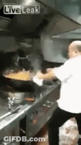 Man Cooking Food In Kitchen GIF