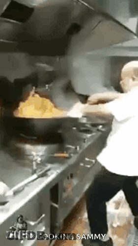 Man Cooking Food In Kitchen GIF