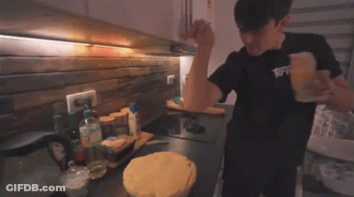 Man Cooking Pie In Kitchen GIF