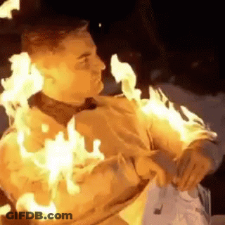 Man Covered In Flames Holding Fork GIF