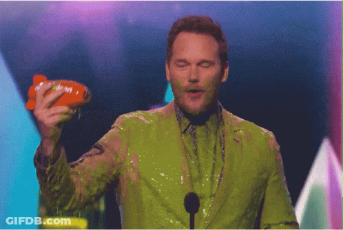 Man Covered In Green Slime Holding Nickelodeon Toy GIF