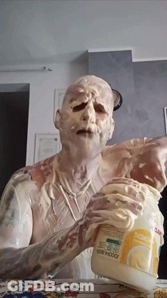 Man Covered In Mayonnaise Holding Jar GIF